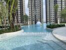 Swimming pool area with high-rise buildings in the background