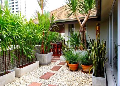 Beautifully designed outdoor patio with plants and seating area