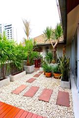 Beautifully designed outdoor patio with plants and seating area