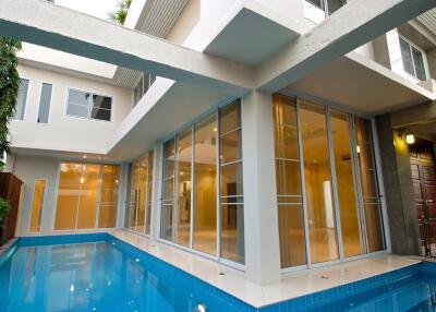 Modern building with glass doors and swimming pool