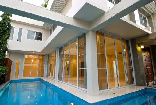 Modern building with glass doors and swimming pool