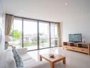 Modern living room with large windows and natural light