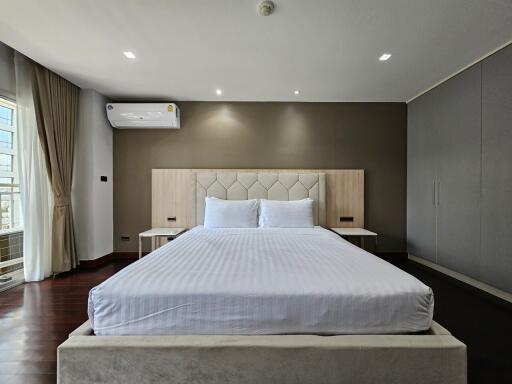 Modern bedroom with large bed and clean decor