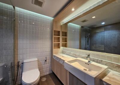 Modern bathroom with large mirror and marble countertop