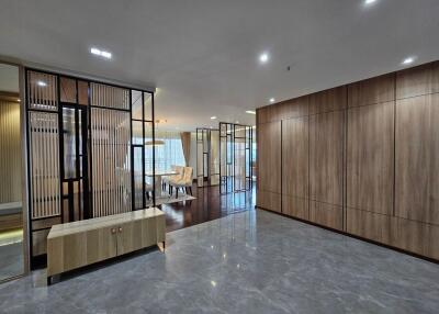 Spacious and modern living space with ample lighting and elegant furnishings