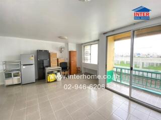 Spacious living area with balcony and storage space