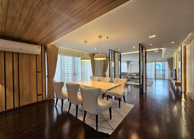 Spacious dining area connected to the living room with modern furnishings