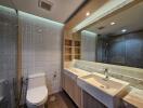 Modern bathroom with large mirror and stylish fixtures