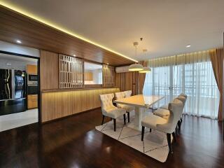 Modern dining room with wooden accents and natural light