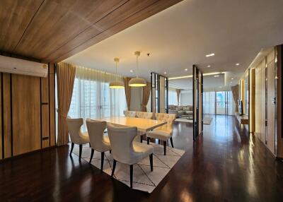 Luxury dining room with modern lighting and wooden accents