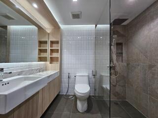 Modern bathroom with glass shower and large, mounted sink