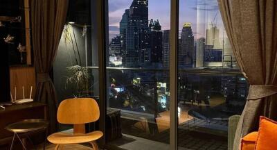 Living room with a view of the city skyline at night