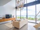 Modern living room with large windows and ocean view