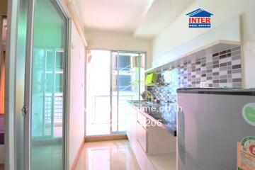 Modern kitchen with grey backsplash and sliding door