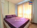 Bright bedroom with double bed and large windows