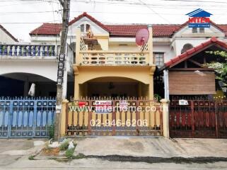 Front view of the house with gated entrance