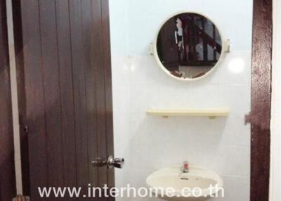 Small bathroom with a sink and a mirror