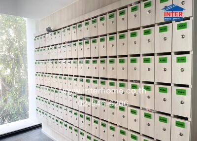 Wall of mailboxes with labels and numbers