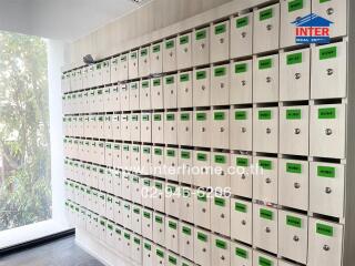 Wall of mailboxes with labels and numbers