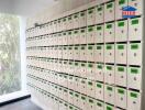 Wall of mailboxes with labels and numbers