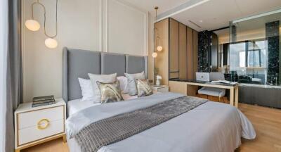 Modern bedroom with gray bedspread and contemporary decor