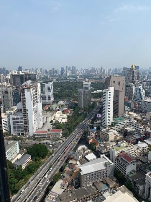 Aerial view of a busy city with multiple high-rise buildings.