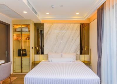 Modern and elegant bedroom with a double bed and built-in wardrobe
