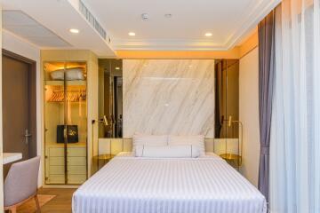 Modern and elegant bedroom with a double bed and built-in wardrobe