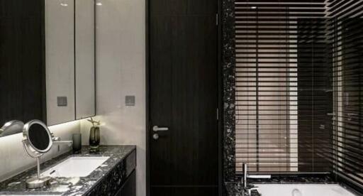 Modern bathroom with marble countertop and wooden blinds