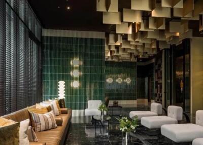 Modern lobby with stylish seating and decorative ceiling