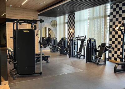 Modern gym area with various exercise equipment