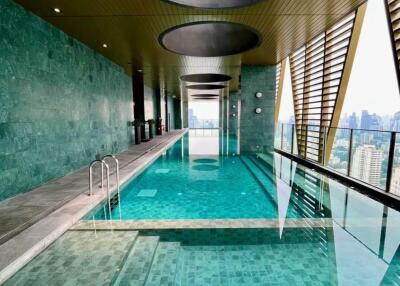 Luxurious indoor swimming pool with a city view