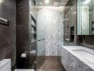 Modern bathroom with glass shower and marble surfaces