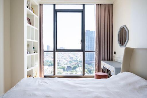 Modern bedroom with a large window and a view