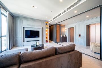 Spacious modern living room with entertainment center and comfortable seating