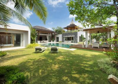 Luxurious backyard with pool and modern outdoor lounging area