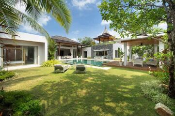 Luxurious backyard with pool and modern outdoor lounging area