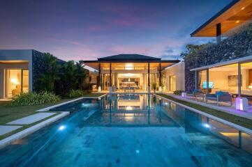 Luxury modern villa with pool at sunset