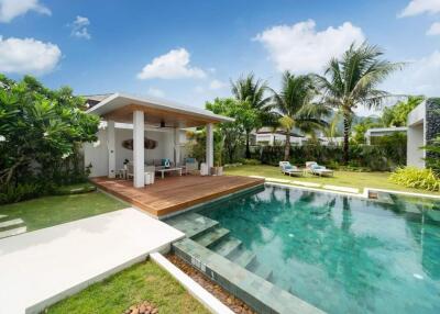 Modern outdoor living space with pool and covered patio