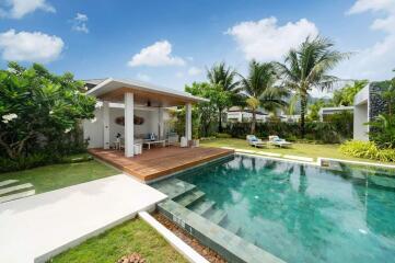 Modern outdoor living space with pool and covered patio