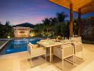 Elegant outdoor dining area with pool at sunset