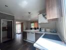 Modern kitchen with stovetop and dining area