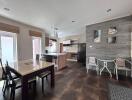 Modern kitchen and dining area with table, chairs, and appliances