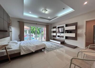 Modern bedroom with large window and balcony view