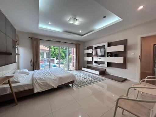 Modern bedroom with large window and balcony view