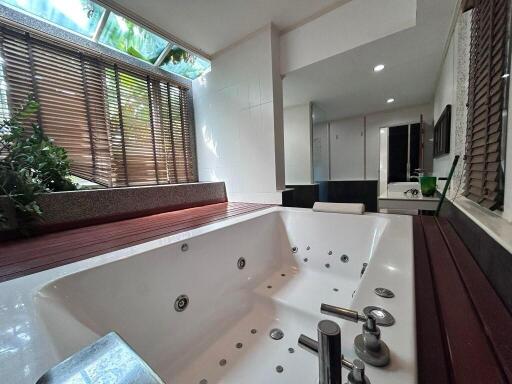 Spacious bathroom featuring a luxurious spa bathtub