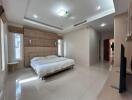 Modern bedroom with double bed, built-in wardrobe, and natural light