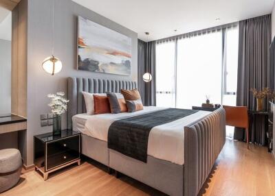 Modern bedroom with large windows, double bed, and contemporary decor