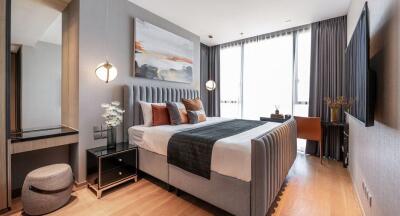 Modern bedroom with large windows, double bed, and contemporary decor