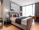 Modern bedroom with large windows, double bed, and contemporary decor